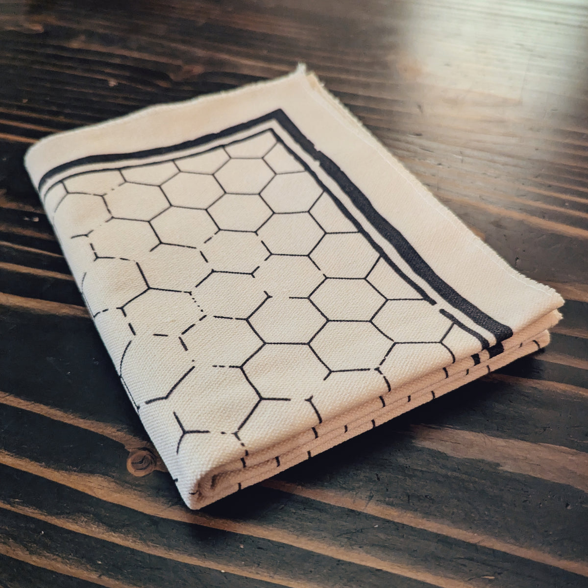 21x27 inch hex grid battle map with 1-inch hex pattern, weathered screen-printed design. Flat, foldable, and travel-friendly tabletop map for tactical RPG encounters.