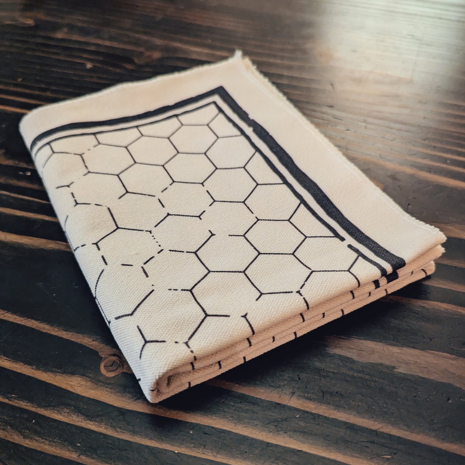 21x27 inch hex grid battle map with 1-inch hex pattern, weathered screen-printed design. Flat, foldable, and travel-friendly tabletop map for tactical RPG encounters.