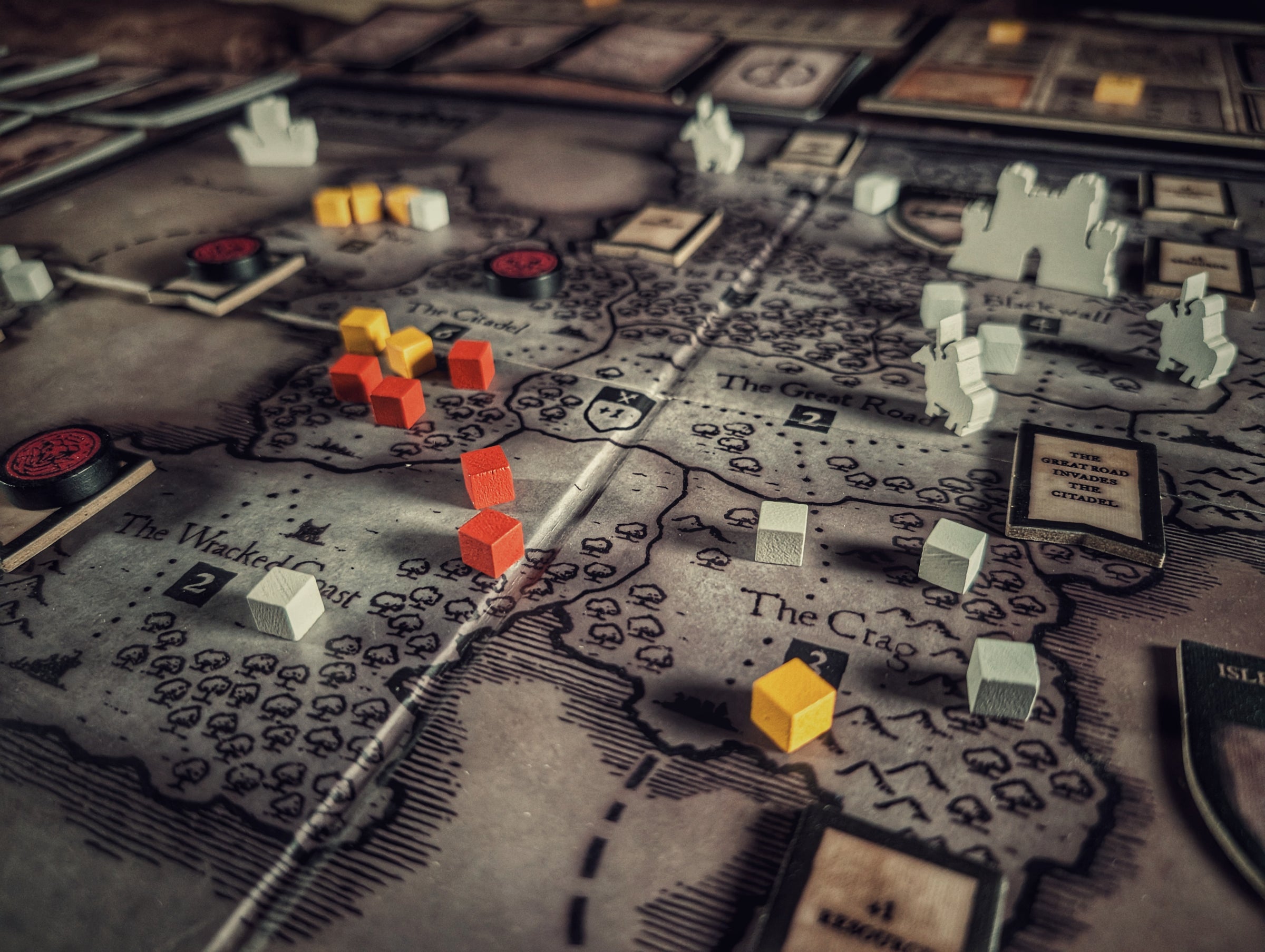 Cultist and Inquisitor pieces on the map of the accursed realm in Archon Game's cult strategy deckbuilding board game - Eschaton: Iconoclasm