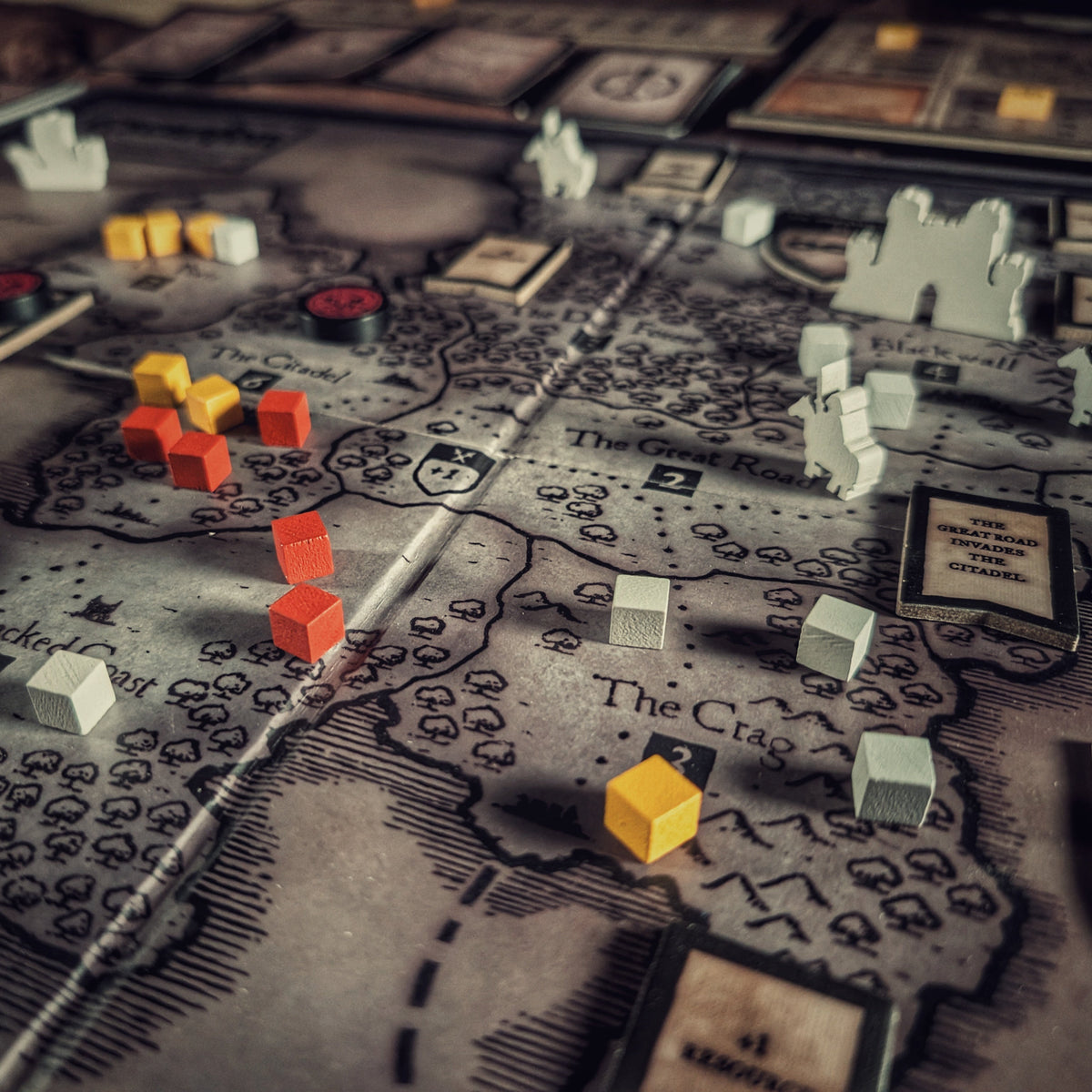 Inquisitor forces dominate half the realm in Eschaton: Iconoclasm. Detail view of board game tokens on the game board.