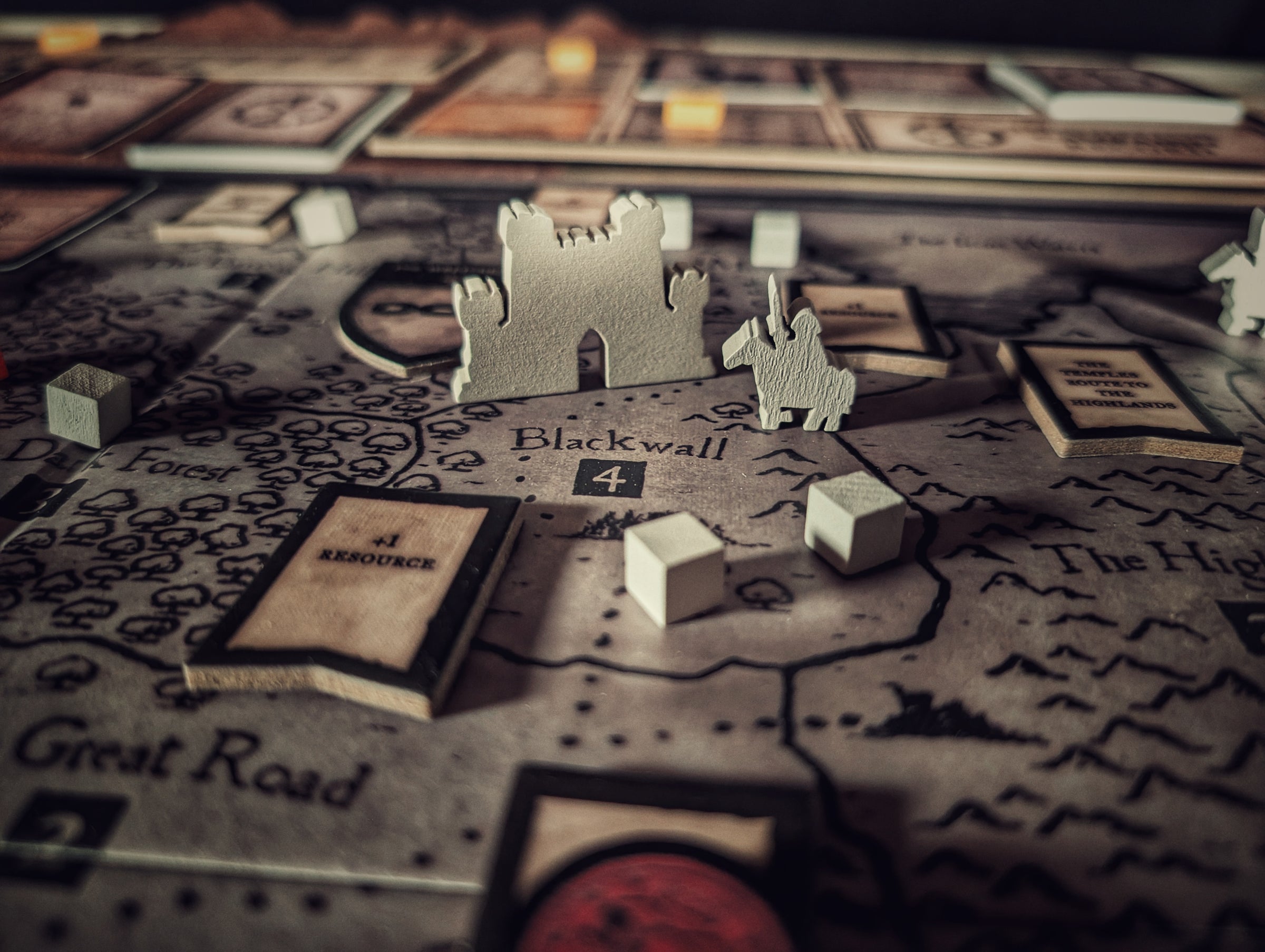 Inquisitor board game pieces on a map with 'Blackwall' and 'Great Road' text