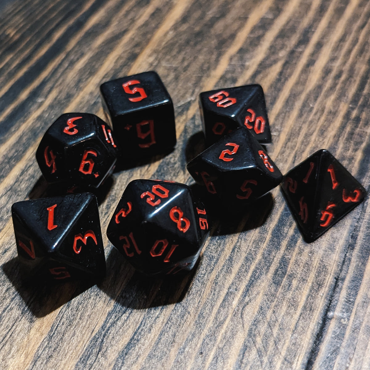 Black and Red DND dice set.High-contrast dark fantasy polyhedral RPG dice.